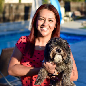 Ivy Ruiz holding her dog, Avocado